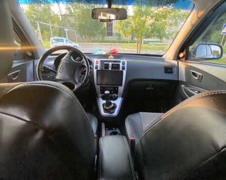 Черный Хендай Туксон, объемом двигателя 1.98 л и пробегом 254 тыс. км за 7700 $, фото 13 на Automoto.ua