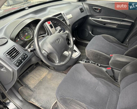 Черный Хендай Туксон, объемом двигателя 2 л и пробегом 157 тыс. км за 8900 $, фото 25 на Automoto.ua