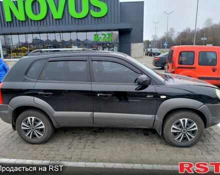 Чорний Хендай Туксон, об'ємом двигуна 2 л та пробігом 106 тис. км за 8350 $, фото 1 на Automoto.ua