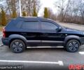Черный Хендай Туксон, объемом двигателя 2 л и пробегом 140 тыс. км за 8200 $, фото 6 на Automoto.ua