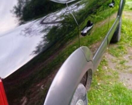 Черный Хендай Туксон, объемом двигателя 1.98 л и пробегом 200 тыс. км за 6600 $, фото 4 на Automoto.ua