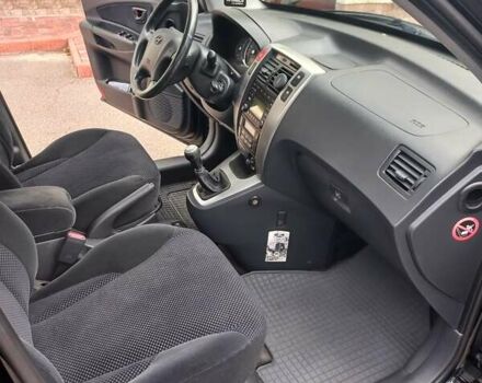 Черный Хендай Туксон, объемом двигателя 2 л и пробегом 168 тыс. км за 9000 $, фото 31 на Automoto.ua