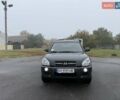 Черный Хендай Туксон, объемом двигателя 1.98 л и пробегом 165 тыс. км за 8600 $, фото 1 на Automoto.ua