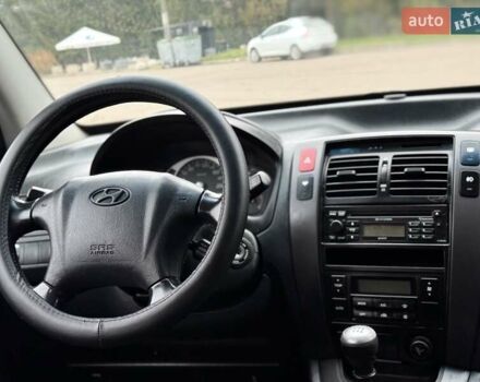 Черный Хендай Туксон, объемом двигателя 1.99 л и пробегом 240 тыс. км за 7200 $, фото 55 на Automoto.ua