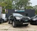 Черный Хендай Туксон, объемом двигателя 2 л и пробегом 200 тыс. км за 8500 $, фото 1 на Automoto.ua