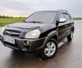 Чорний Хендай Туксон, об'ємом двигуна 2 л та пробігом 255 тис. км за 8950 $, фото 1 на Automoto.ua
