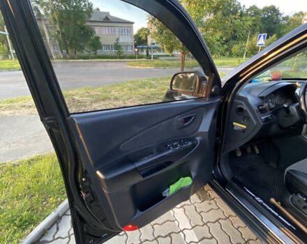 Черный Хендай Туксон, объемом двигателя 1.98 л и пробегом 254 тыс. км за 7700 $, фото 10 на Automoto.ua