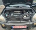 Черный Хендай Туксон, объемом двигателя 2 л и пробегом 255 тыс. км за 8700 $, фото 32 на Automoto.ua