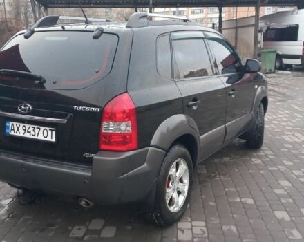 Черный Хендай Туксон, объемом двигателя 2 л и пробегом 200 тыс. км за 8300 $, фото 6 на Automoto.ua