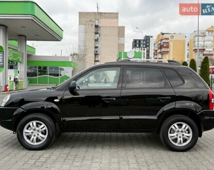Черный Хендай Туксон, объемом двигателя 1.98 л и пробегом 239 тыс. км за 8700 $, фото 2 на Automoto.ua