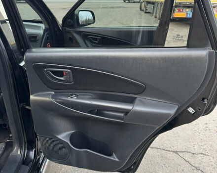 Черный Хендай Туксон, объемом двигателя 2 л и пробегом 210 тыс. км за 7850 $, фото 25 на Automoto.ua