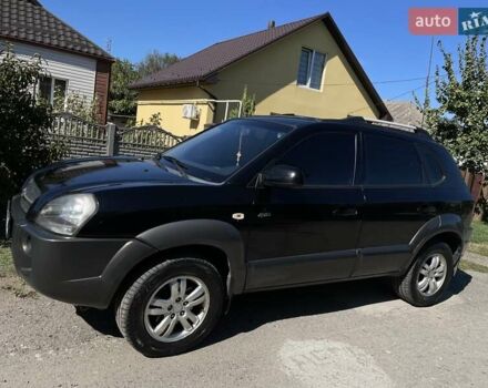 Черный Хендай Туксон, объемом двигателя 2 л и пробегом 334 тыс. км за 8700 $, фото 2 на Automoto.ua