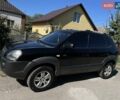 Черный Хендай Туксон, объемом двигателя 2 л и пробегом 334 тыс. км за 8700 $, фото 2 на Automoto.ua