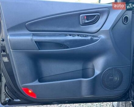 Черный Хендай Туксон, объемом двигателя 2 л и пробегом 230 тыс. км за 7500 $, фото 10 на Automoto.ua