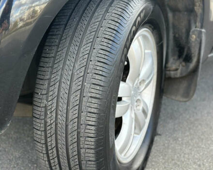 Черный Хендай Туксон, объемом двигателя 2 л и пробегом 300 тыс. км за 8300 $, фото 7 на Automoto.ua