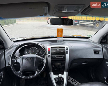 Черный Хендай Туксон, объемом двигателя 1.98 л и пробегом 205 тыс. км за 7950 $, фото 17 на Automoto.ua