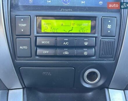 Черный Хендай Туксон, объемом двигателя 2 л и пробегом 230 тыс. км за 7500 $, фото 21 на Automoto.ua