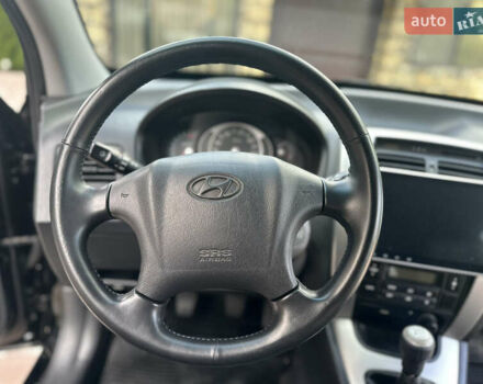 Черный Хендай Туксон, объемом двигателя 2 л и пробегом 218 тыс. км за 8700 $, фото 36 на Automoto.ua