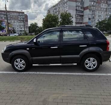 Черный Хендай Туксон, объемом двигателя 1.98 л и пробегом 42 тыс. км за 12000 $, фото 1 на Automoto.ua