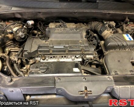 Черный Хендай Туксон, объемом двигателя 2 л и пробегом 220 тыс. км за 8000 $, фото 8 на Automoto.ua