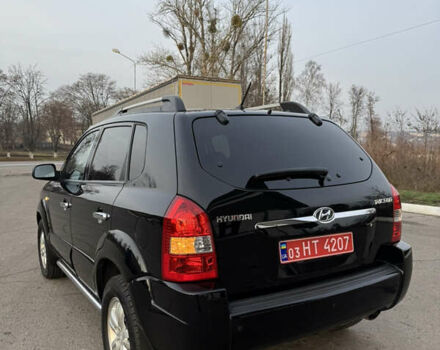 Черный Хендай Туксон, объемом двигателя 2 л и пробегом 210 тыс. км за 7850 $, фото 14 на Automoto.ua