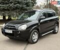 Черный Хендай Туксон, объемом двигателя 1.99 л и пробегом 240 тыс. км за 7200 $, фото 1 на Automoto.ua