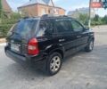 Черный Хендай Туксон, объемом двигателя 2 л и пробегом 260 тыс. км за 6950 $, фото 3 на Automoto.ua