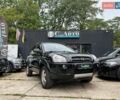 Черный Хендай Туксон, объемом двигателя 2 л и пробегом 200 тыс. км за 7300 $, фото 1 на Automoto.ua