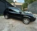 Черный Хендай Туксон, объемом двигателя 2 л и пробегом 245 тыс. км за 6500 $, фото 3 на Automoto.ua