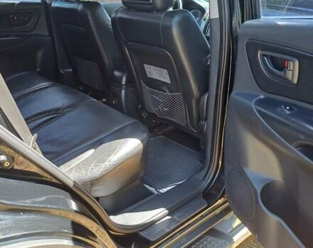 Черный Хендай Туксон, объемом двигателя 1.98 л и пробегом 189 тыс. км за 7800 $, фото 8 на Automoto.ua