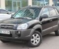 Черный Хендай Туксон, объемом двигателя 2 л и пробегом 210 тыс. км за 8999 $, фото 1 на Automoto.ua