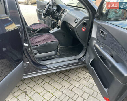 Черный Хендай Туксон, объемом двигателя 1.98 л и пробегом 177 тыс. км за 7600 $, фото 24 на Automoto.ua