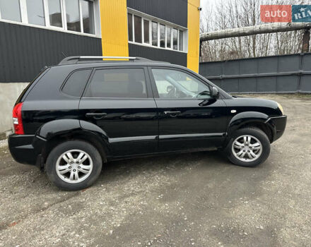 Чорний Хендай Туксон, об'ємом двигуна 2 л та пробігом 243 тис. км за 7999 $, фото 23 на Automoto.ua