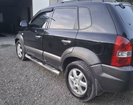 Черный Хендай Туксон, объемом двигателя 2 л и пробегом 197 тыс. км за 8000 $, фото 10 на Automoto.ua