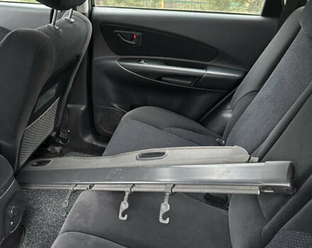 Черный Хендай Туксон, объемом двигателя 2 л и пробегом 136 тыс. км за 8500 $, фото 28 на Automoto.ua