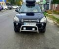 Черный Хендай Туксон, объемом двигателя 2 л и пробегом 240 тыс. км за 7500 $, фото 1 на Automoto.ua