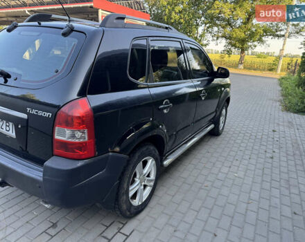 Черный Хендай Туксон, объемом двигателя 2 л и пробегом 290 тыс. км за 5400 $, фото 4 на Automoto.ua