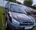 Черный Хендай Туксон, объемом двигателя 2 л и пробегом 240 тыс. км за 8000 $, фото 1 на Automoto.ua