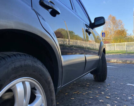 Черный Хендай Туксон, объемом двигателя 1.98 л и пробегом 218 тыс. км за 7200 $, фото 5 на Automoto.ua