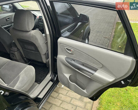 Черный Хендай Туксон, объемом двигателя 2 л и пробегом 107 тыс. км за 8900 $, фото 28 на Automoto.ua