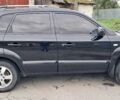 Черный Хендай Туксон, объемом двигателя 2 л и пробегом 270 тыс. км за 8300 $, фото 1 на Automoto.ua