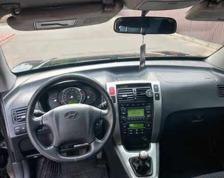 Черный Хендай Туксон, объемом двигателя 2 л и пробегом 168 тыс. км за 9000 $, фото 22 на Automoto.ua