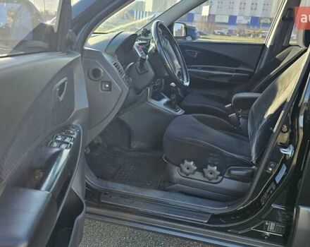 Чорний Хендай Туксон, об'ємом двигуна 1.98 л та пробігом 212 тис. км за 7766 $, фото 10 на Automoto.ua
