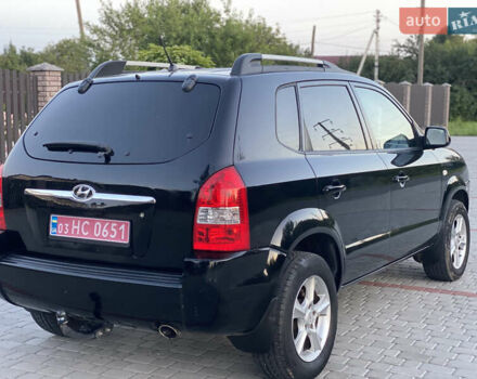 Черный Хендай Туксон, объемом двигателя 2 л и пробегом 250 тыс. км за 7950 $, фото 7 на Automoto.ua