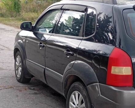 Чорний Хендай Туксон, об'ємом двигуна 2 л та пробігом 142 тис. км за 4650 $, фото 1 на Automoto.ua