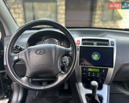 Черный Хендай Туксон, объемом двигателя 2 л и пробегом 218 тыс. км за 8700 $, фото 37 на Automoto.ua