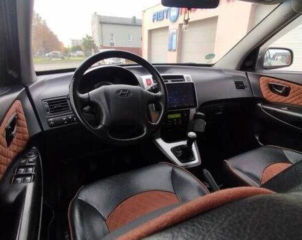 Черный Хендай Туксон, объемом двигателя 1.98 л и пробегом 214 тыс. км за 7700 $, фото 19 на Automoto.ua
