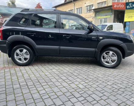 Черный Хендай Туксон, объемом двигателя 1.98 л и пробегом 177 тыс. км за 7600 $, фото 6 на Automoto.ua