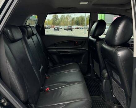 Черный Хендай Туксон, объемом двигателя 1.98 л и пробегом 202 тыс. км за 8350 $, фото 1 на Automoto.ua