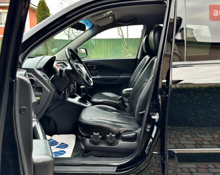 Чорний Хендай Туксон, об'ємом двигуна 2 л та пробігом 182 тис. км за 8299 $, фото 48 на Automoto.ua